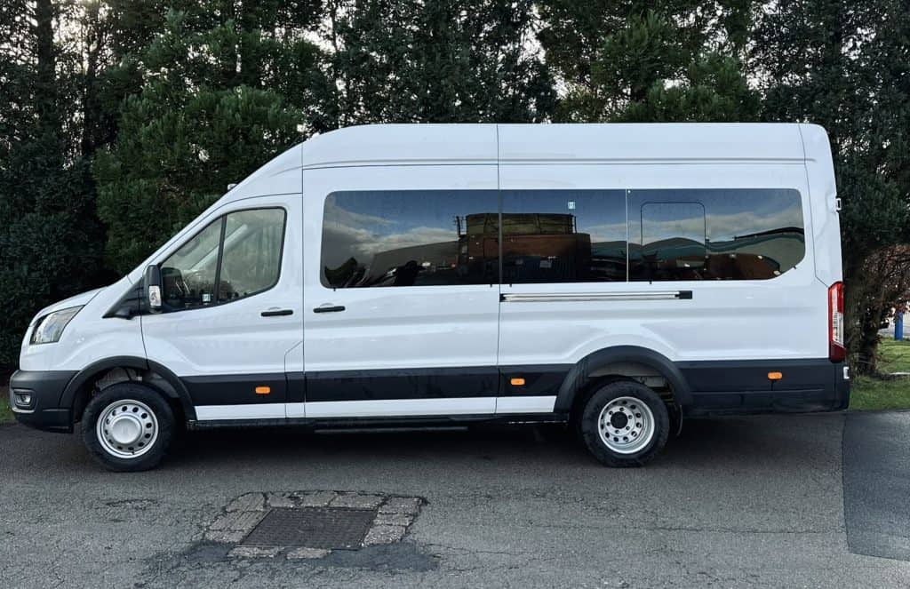 Side view of the 2025 Ford Transit Trend 17‑Seat Minibus