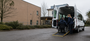 Wheelchair accessible minibus with passenger ramp